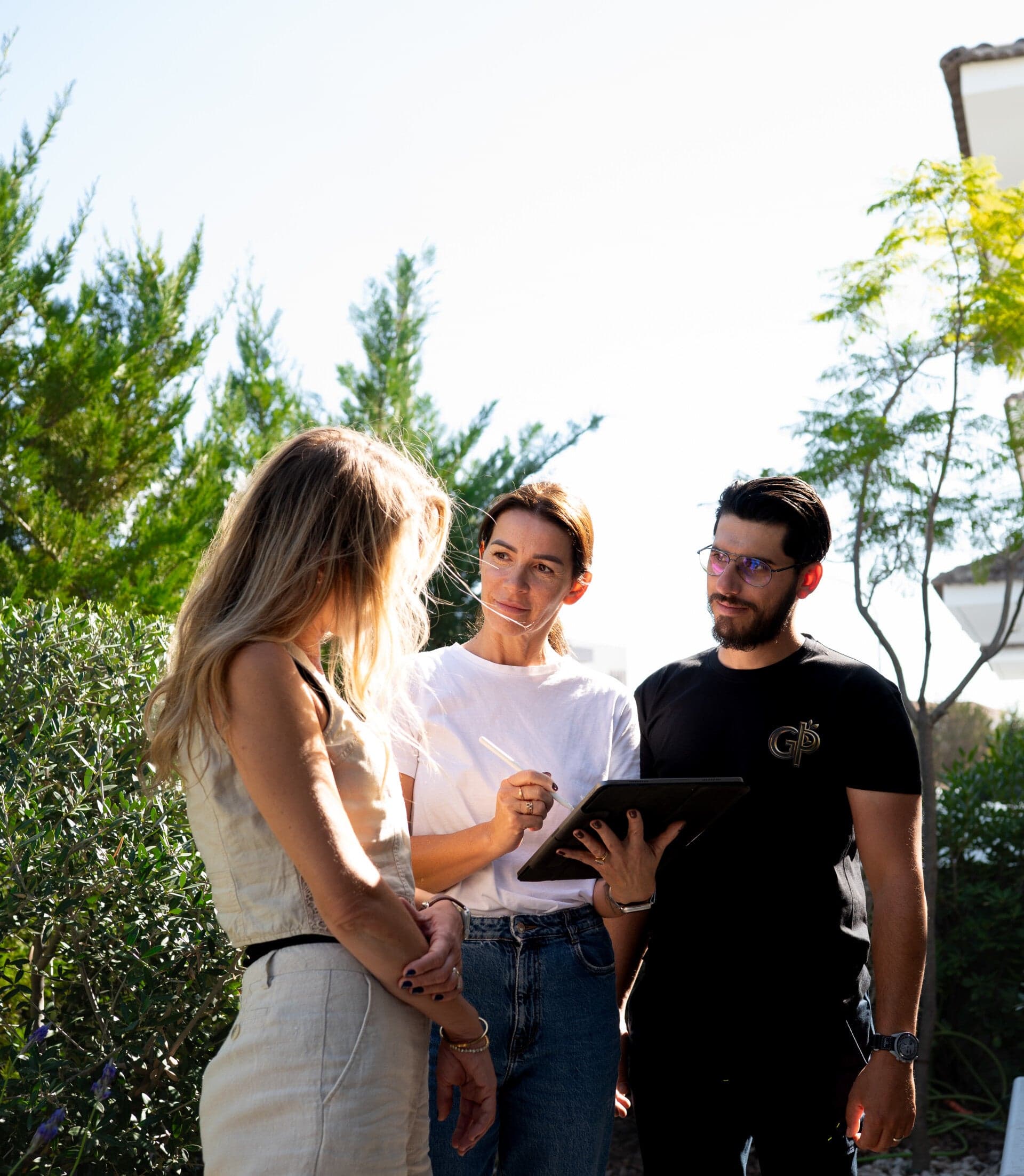 Green Planet team consulting with clients on luxury garden design