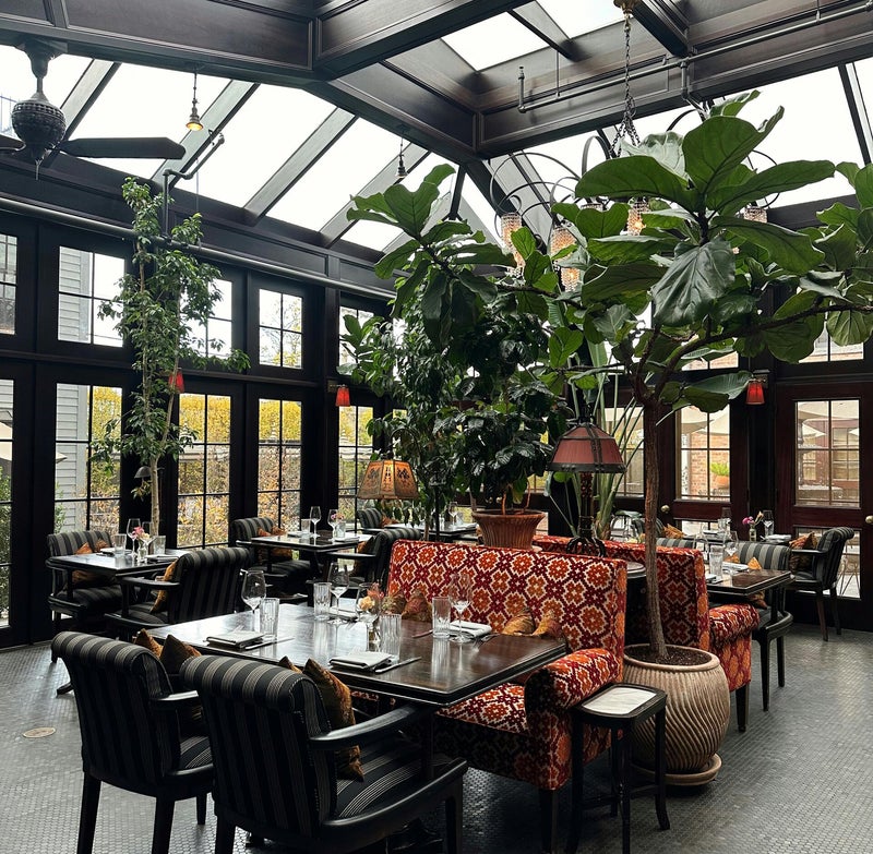 Cosy outdoor winter living space with warm lighting and comfortable seating